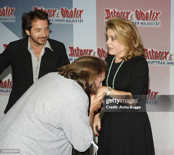 French actors Edouard Baer , Catherine Deneuve and Gerard Depardieu attend the "Asterix & Obelix God Save Britannia" photocall at Hotel de Rome on...