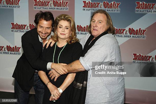 French actors Edouard Baer , Catherine Deneuve and Gerard Depardieu attend the "Asterix & Obelix God Save Britannia" photocall at Hotel de Rome on...