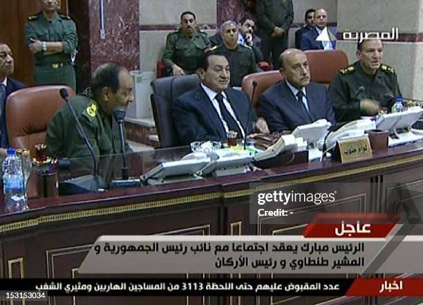An image grab taken from Egyptian state televsion Al-Masriya shows Egyptian President Hosni Mubarak meeting with his new Vice President Omar Suleiman...