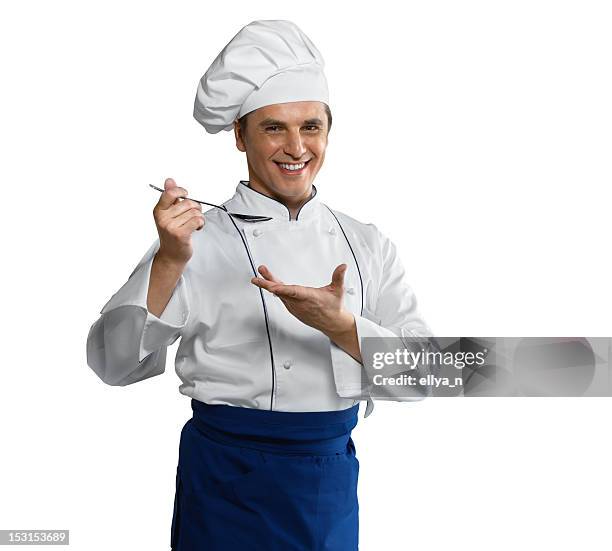 smiling young chef with a spoon - toque stock pictures, royalty-free photos & images