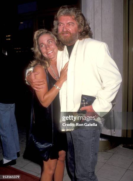 Writer Joe Eszterhas and date Naomi Baca attend the "Sliver" Westwood Premiere on May 19, 1993 at Mann National Theatre in Westwood, California.