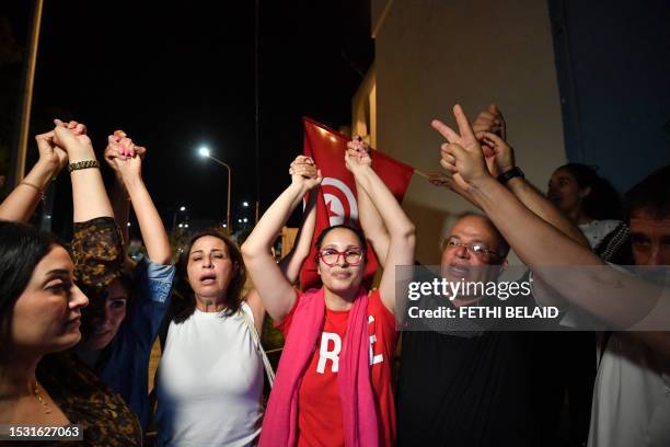Chaima Issa, journalist, human rights defender and member of the main opposition coalition , greets her family and supporters on her release from...