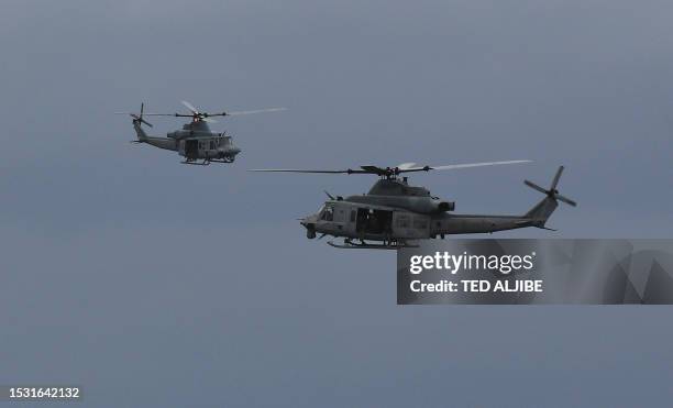 Marines UH-1Y Venom helicopters hover during a helocast and maritime patrol training exercise as part of the semiannual Philippine-US military...