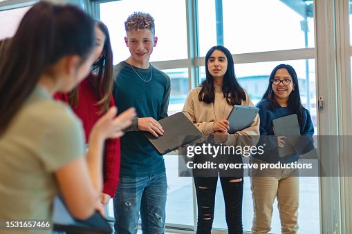 Multiracial Group of Mixed Gender Teens in Educational Building Walking Together to Class Photo Series Multiracial Group of Mixed Gender Teens in Educational Building Walking Together to Class Photo Series
