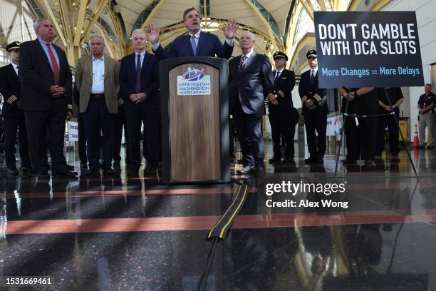 Sen. Mark Warner speaks as CEO of the Metropolitan Washington Airports Authority Jack Potter, Sen. Tim Kaine , Sen. Chris Van Hollen and Sen. Ben...