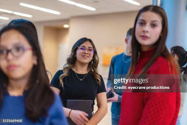 multiracial group of mixed gender teens in educational building walking together to class photo series - yokohama f marinos v sanfrecce hiroshima 97th emperors cup round of 16 stockfoto's en -beelden