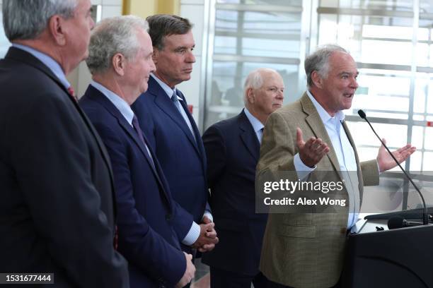 Sen. Tim Kaine speaks as CEO of the Metropolitan Washington Airports Authority Jack Potter, Sen. Chris Van Hollen , Sen. Mark Warner , and Sen. Ben...