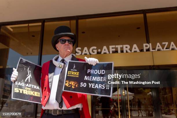 Gregg Donovan who calls himself the ambassador of Hollywood and is an actor stands in support outside of the SAG-AFTRA offices on Thursday after the...