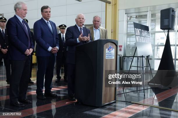 Sen. Ben Cardin speaks as Sen. Chris Van Hollen , Sen. Mark Warner and Sen. Tim Kaine listen during a news conference at Ronald Reagan Washington...