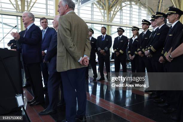 Sen. Chris Van Hollen speaks as Sen. Mark Warner , Sen. Ben Cardin , Sen. Tim Kaine and pilots from American Airlines and United Airlines listen...