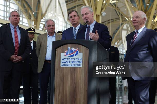 Sen. Chris Van Hollen speaks as CEO of the Metropolitan Washington Airports Authority Jack Potter, Sen. Tim Kaine , Sen. Mark Warner , and Sen. Ben...