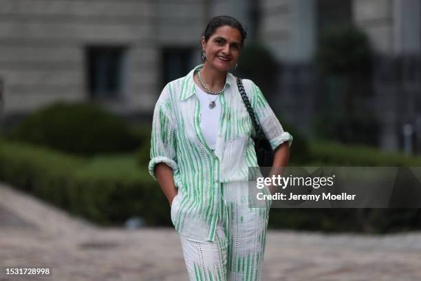 Leyla Piedayesh is seen wearing a complete outfit from Lala Berlin, consisting of a matching two-piece suit with a white/green striped rolled up...