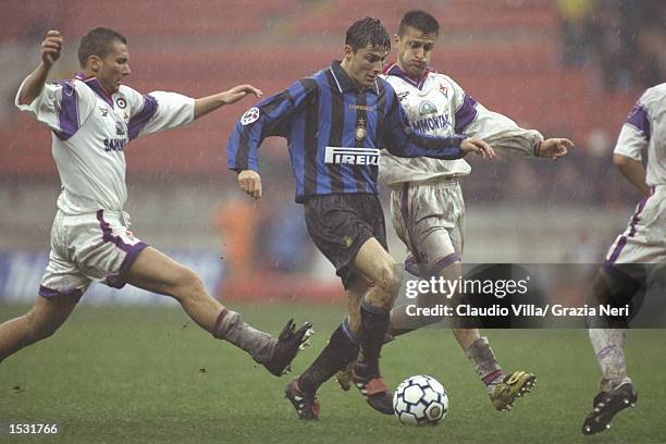 Javier Zanetti of Inter takes on the Fiorentina defence during the Serie A match between Inter Milan and Fiorentina at the San Siro Stadium in Milan,...