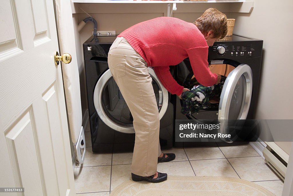 Woman doing laundry in home