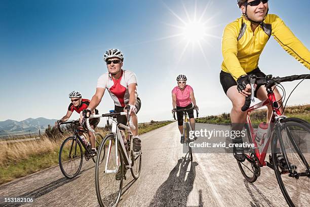 road cyclists riding together - racefiets stockfoto's en -beelden