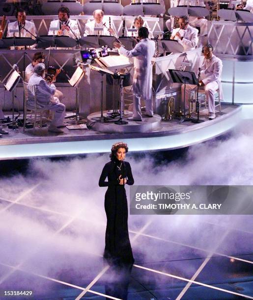 Celine Dion sings the song from the movie Titanic "My Heart Will Go On" during the 70th Academy Awards at the Shrine Auditorium 23 March. "My Heart...