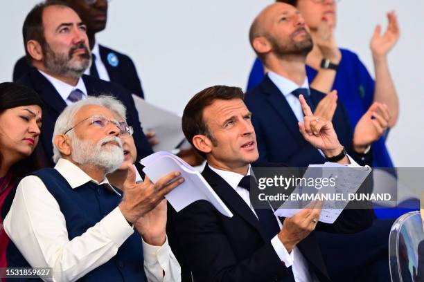 India's Prime Minister Narendra Modi and French President Emmanuel Macron attend the Bastille Day military parade on the Champs-Elysees avenue in...