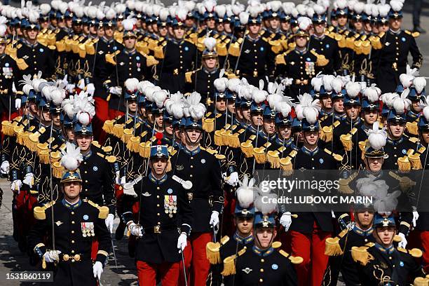 Pupils of the Special Military School of Saint-Cyr march during the Bastille Day military parade on the Champs-Elysees avenue in Paris on July 14,...