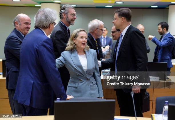 Vice-President of the European Central Bank Luis de Guindos Jurado talks with the EU Commissioner for Economy Paolo Gentiloni, the Spanish Minister...