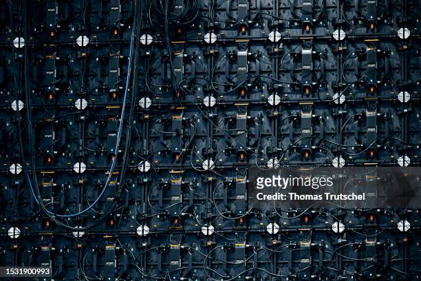 Symbolic photo on the subject of digital networking. Cables hang at the back of monitors on July 11, 2023 in Vilnius, Lithuania.
