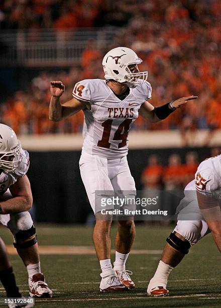 Quarterback David Ash of the Texas Longhorns calls a play against the Oklahoma State Cowboys on September 29, 2012 at Boone Pickens Stadium in...