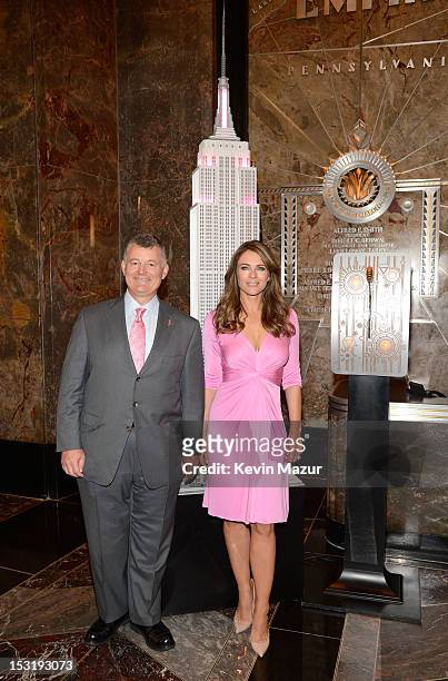 Executive chairman of the Estee Lauder companies, William P. Lauder and Elizabeth Hurley light The Empire State Building pink to celebrate the 20th...