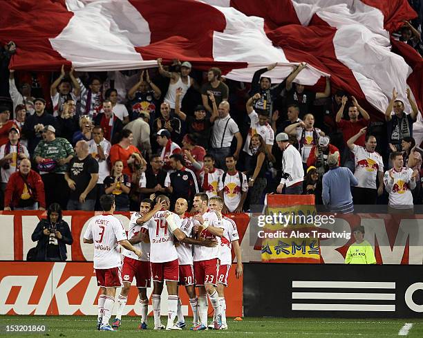 The New York Red Bulls celebrate their final goal against Toronto FC at Red Bull Arena on September 29, 2012 in Harrison, New Jersey.