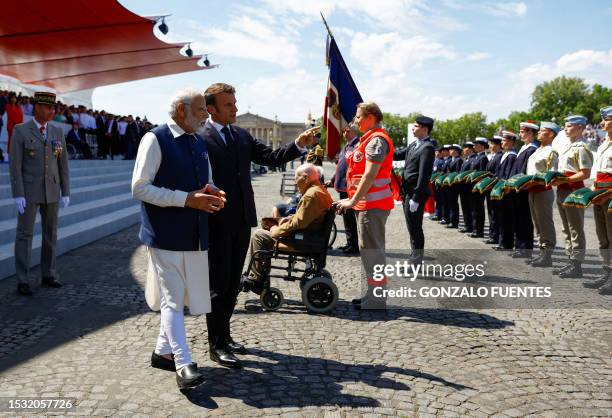 IndianPrime Minister Narendra Modi and French President Emmanuel Macron attend the Bastille Day military parade on the Champs-Elysees avenue in Paris...