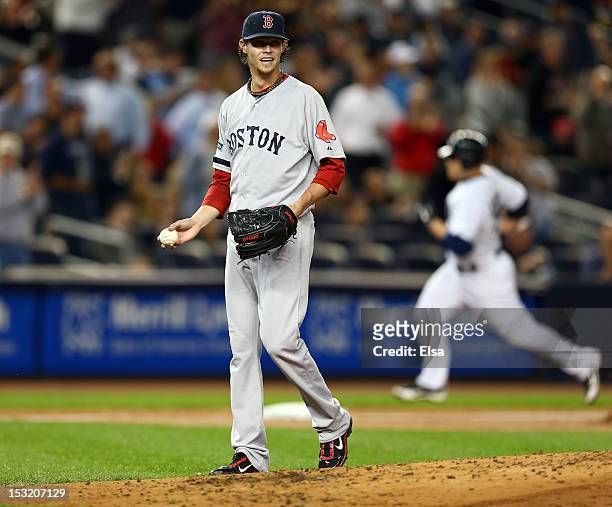 Clay Buchholz of the Boston Red Sox reacts after giving up a home run to Russell Martin of the New York Yankees on October 1, 2012 at Yankee Stadium...