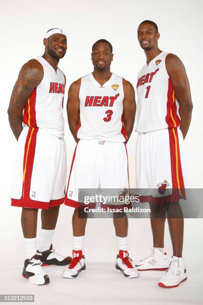 LeBron James, Dwyane Wade and Chris Bosh of the Miami Heat pose for a portrait during the 2012 Miami Heat Media Day on September 28, 2012 at American...