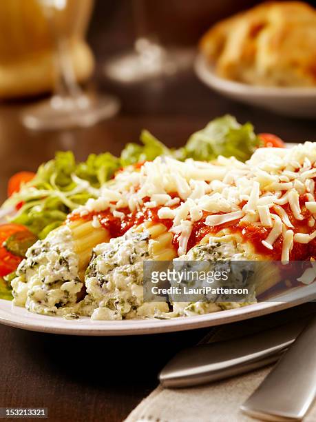 stuffed manicotti with ricotta and spinich - cannelloni stock pictures, royalty-free photos & images