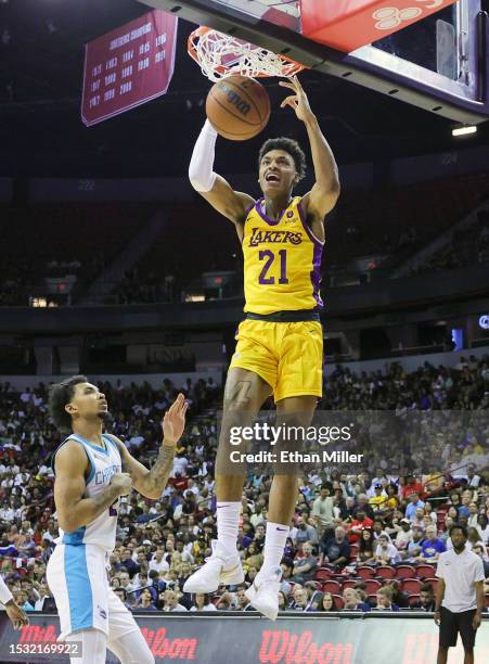 Maxwell Lewis of the Los Angeles Lakers dunks ahead of James Bouknight of the Charlotte Hornets in the second half of a 2023 NBA Summer League game...
