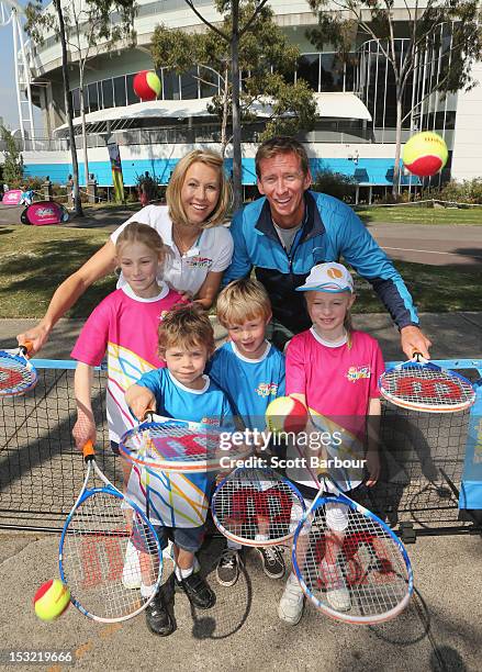 Tennis players Alicia Molik and Wayne Arthurs pose with children during the 2013 Australian Open launch at Melbourne Park on October 2, 2012 in...