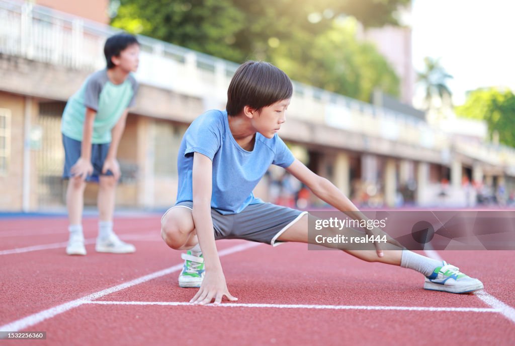 Boy on running track.