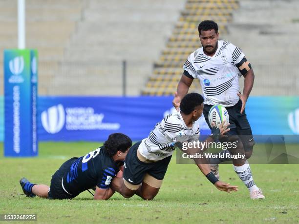 Isikeli Basiyalo of Fiji offloads during the World Rugby U20 Championship 2023, 9th place play-off match between Fiji and Argentina at Danie Craven...