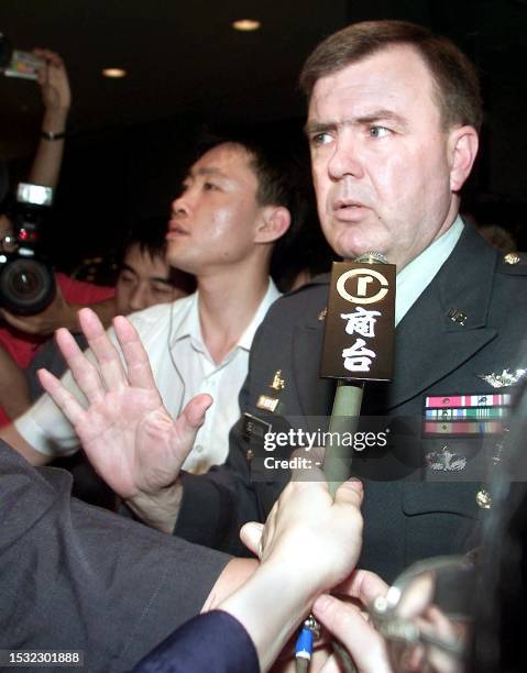 United States Defence Attache Brigadier General Neal Sealock, in full military uniform, makes a brief statement to the press at the hotel lobby after...