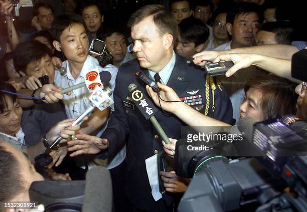United States Defence Attache Brigadier General Neal Sealock, in full military uniform, makes a brief statement to the press at the hotel lobby after...