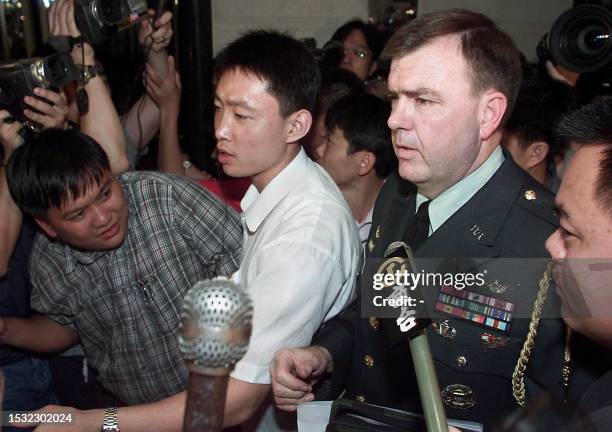 United States Defence Attache Brigadier General Neal Sealock, in full military uniform, makes a brief statement to the press at the hotel lobby after...