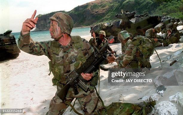 Marines participate in an amphibious assault landing exercises 28 February 2000 at a marine reserve south of Manila as part of an ongoing large-scale...