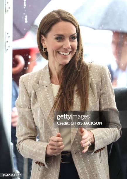 Britain's Catherine, Princess of Wales smiles as she arrives at the Techno Zone, which aims to inspire young people into exploring science,...