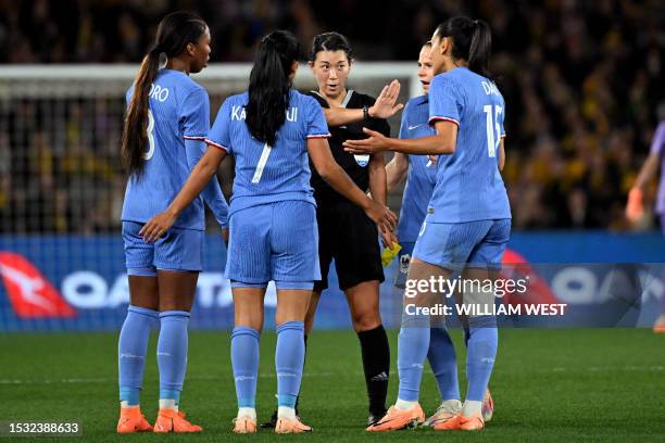 Referee Asaka Noizumi of Japan speaks to French players during the international friendly football match between Australia and France in Melbourne on...