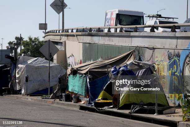 Homeless encampment blocks the sidewalk along 18th Street and Grand next to the 10 FWY east in downtown on Thursday, July 6, 2023 in Los Angeles, CA....