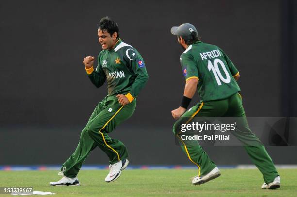 Mohammad Hafeez of Pakistan celebrates the wicket of David Warner of Australia during the ICC World Twenty20 2012 Super Eights Group 2 match between...