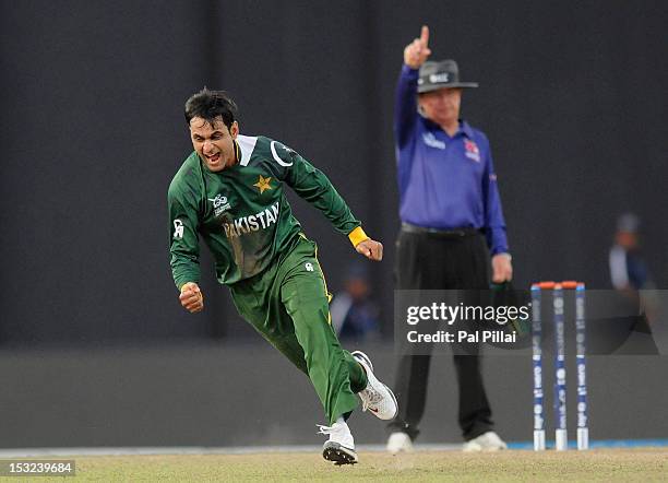 Mohammad Hafeez of Pakistan celebrates the wicket of David Warner of Australia during the ICC World Twenty20 2012 Super Eights Group 2 match between...