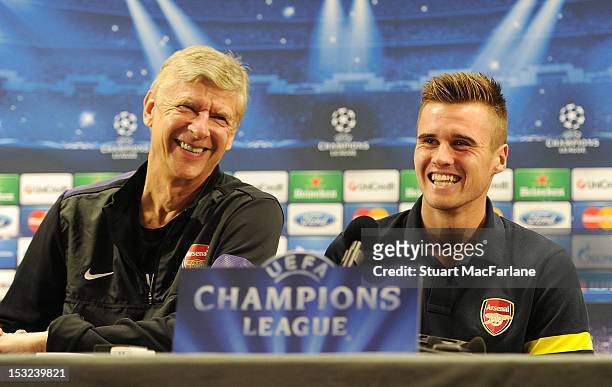 Arsenal manager Arsene Wenger with defender Carl Jenkinson during a Press conference at London Colney on October 2, 2012 in St Albans, England.