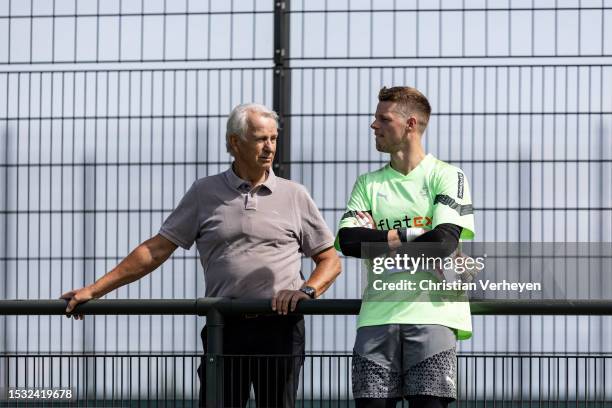 Vice President Rainer Bonhof and Jonas Omlin are seen during a Training session of Borussia Moenchengladbach at Borussia-Park on July 14, 2023 in...