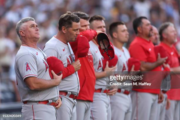 Manager Phil Nevin of the Los Angeles Angels looks on during the national anthem prior to a game against the San Diego Padres at PETCO Park on July...