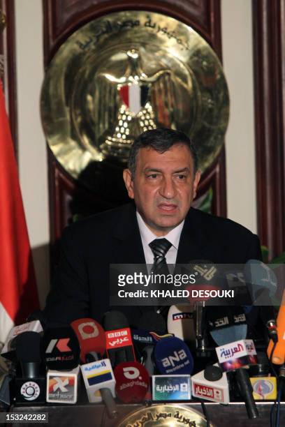 Egypt's new government Prime Minister Essam Sharaf addresses the nation at his office in Cairo on March 7, 2011 as new ministers were sworn in today...