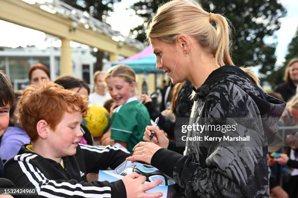 Katie Bowen of the New Zealand Football Ferns signs autographs during a New Zealand Football Ferns Fan Event at Napier Soundshell at on July 11, 2023...