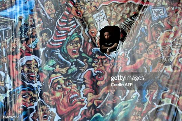 Man looks on as protesters gather in Cairo's landmark Tahrir Square on July 18 to demand political change as anger grows with the military rulers...